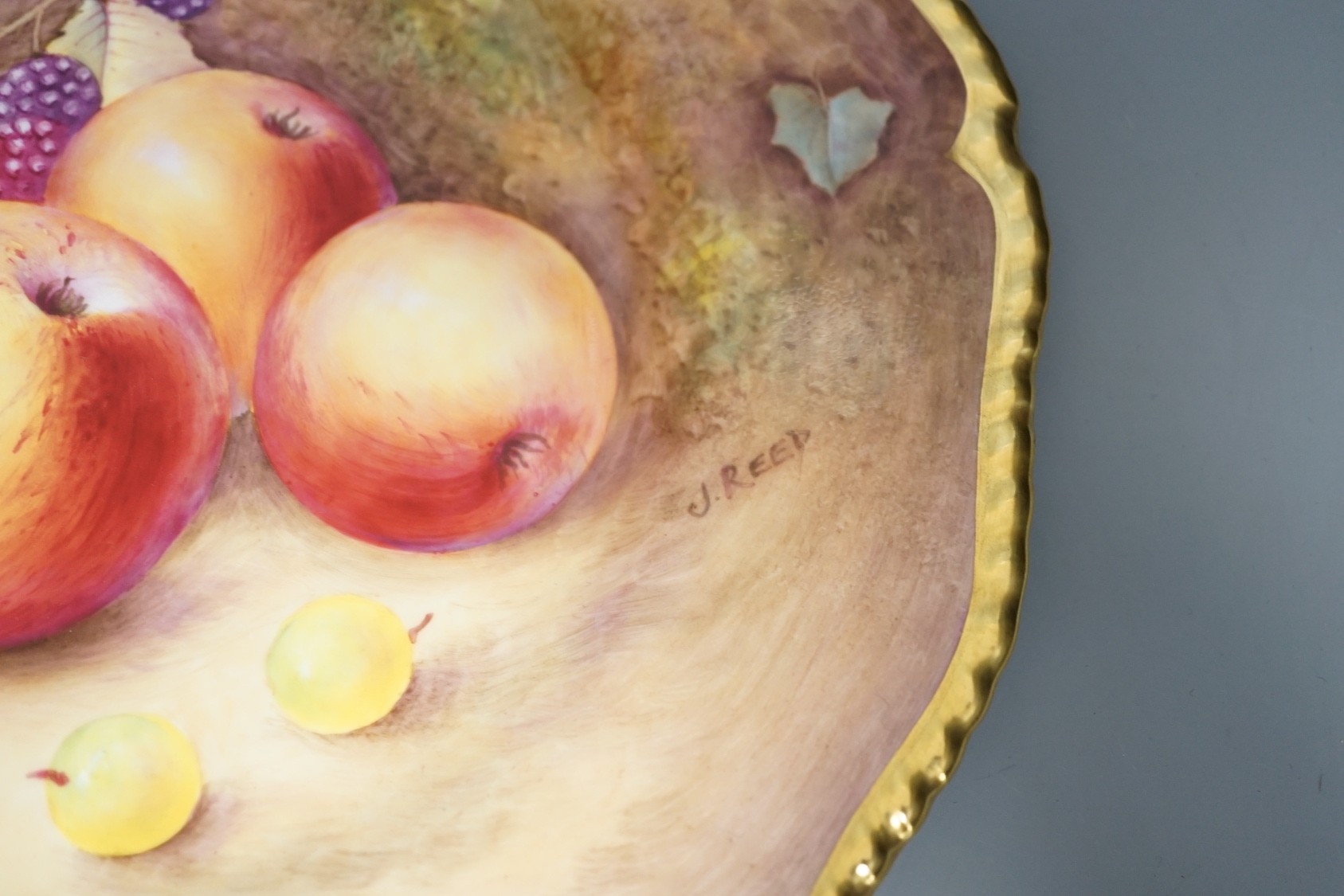 A pair of Royal Worcester fruit painted dinner plates, post war, by J. Reed, 27cm diameter